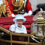 Queen Elizabeth waving from her carriage