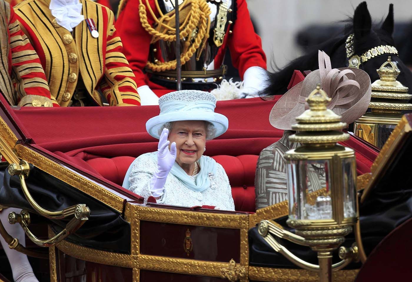 Queen Elizabeth waving from her carriage